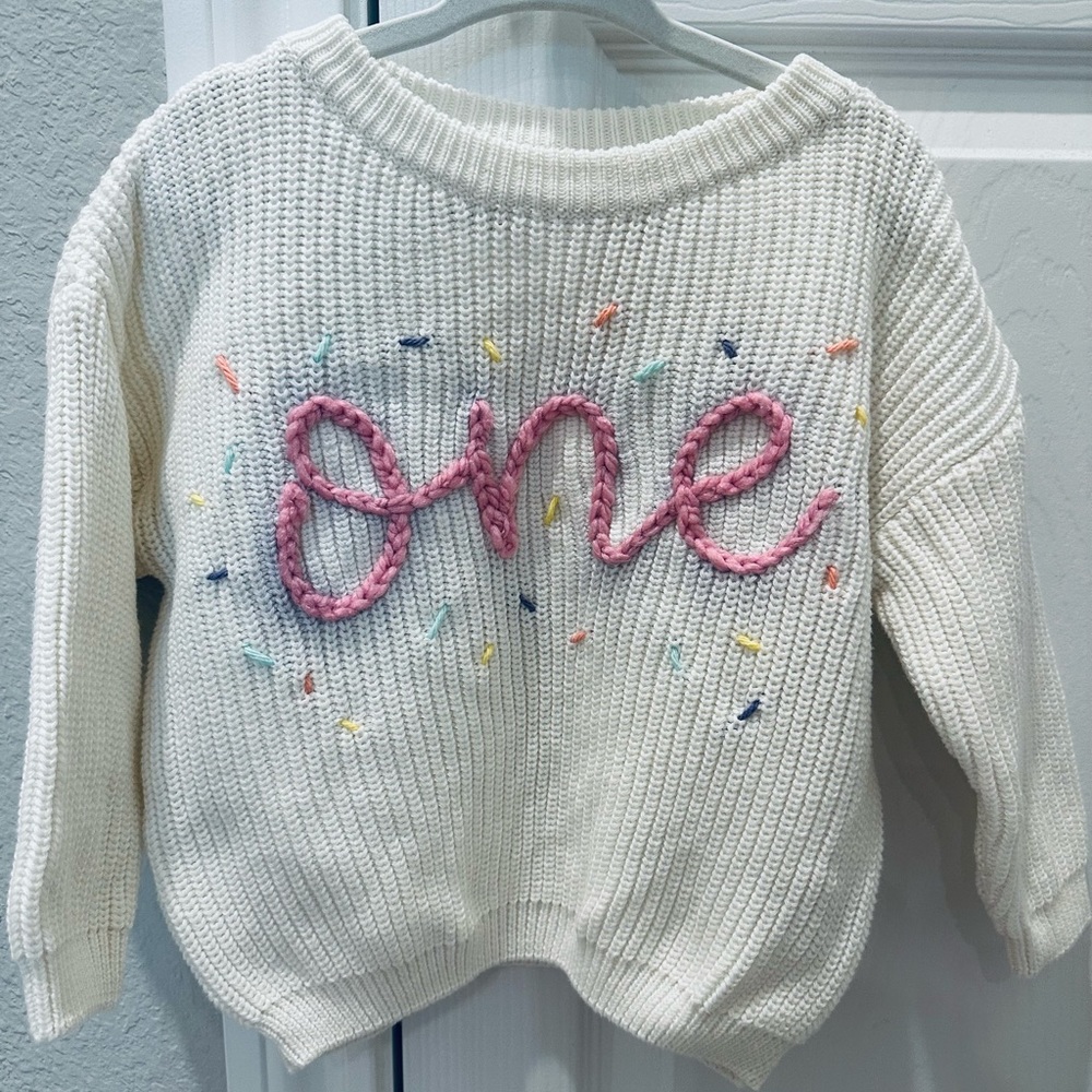 BRAND NEW! Hand embroidered “One” Baby Sweater with confetti sprinkles
